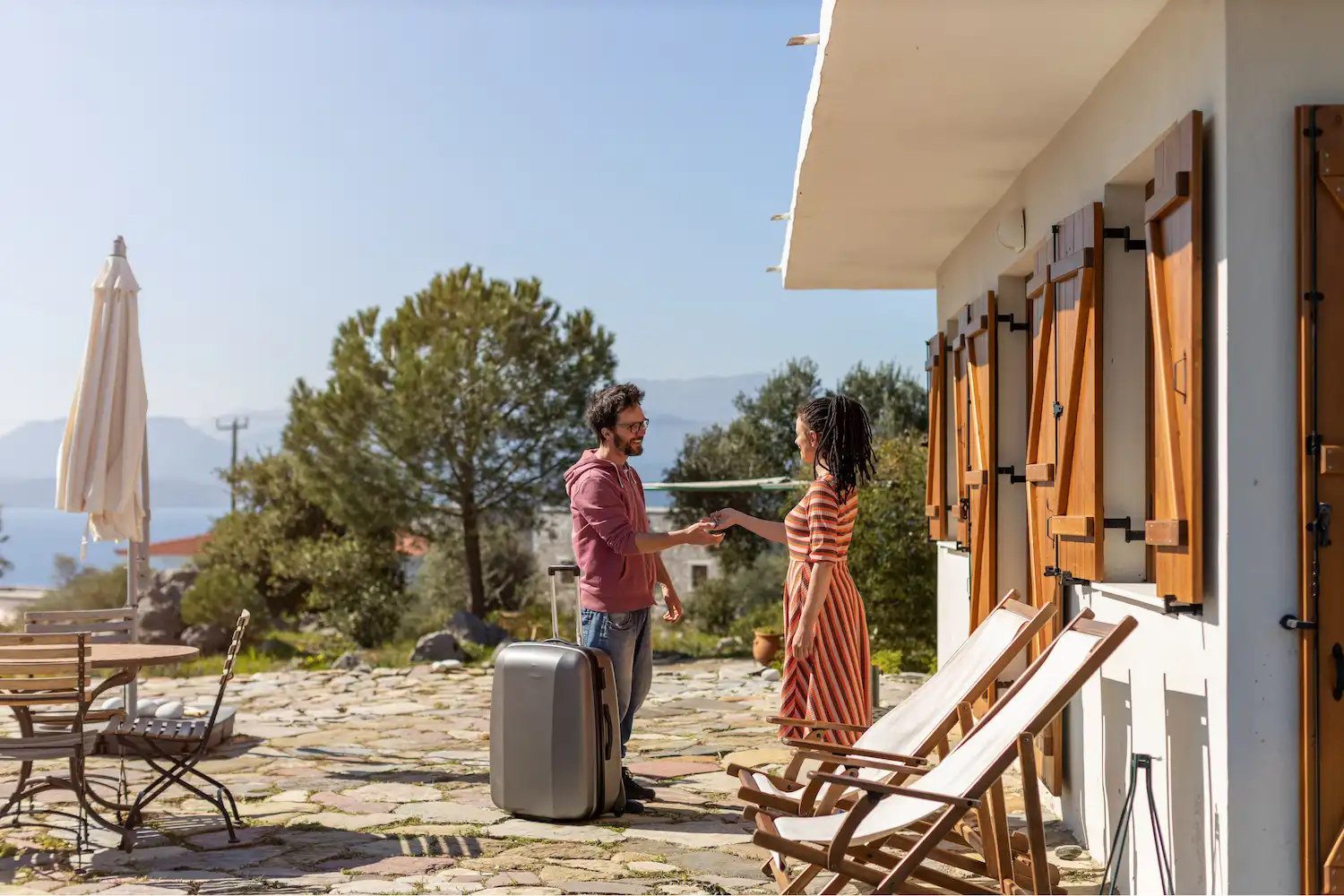 Traveler arriving at a guest house for his vacation