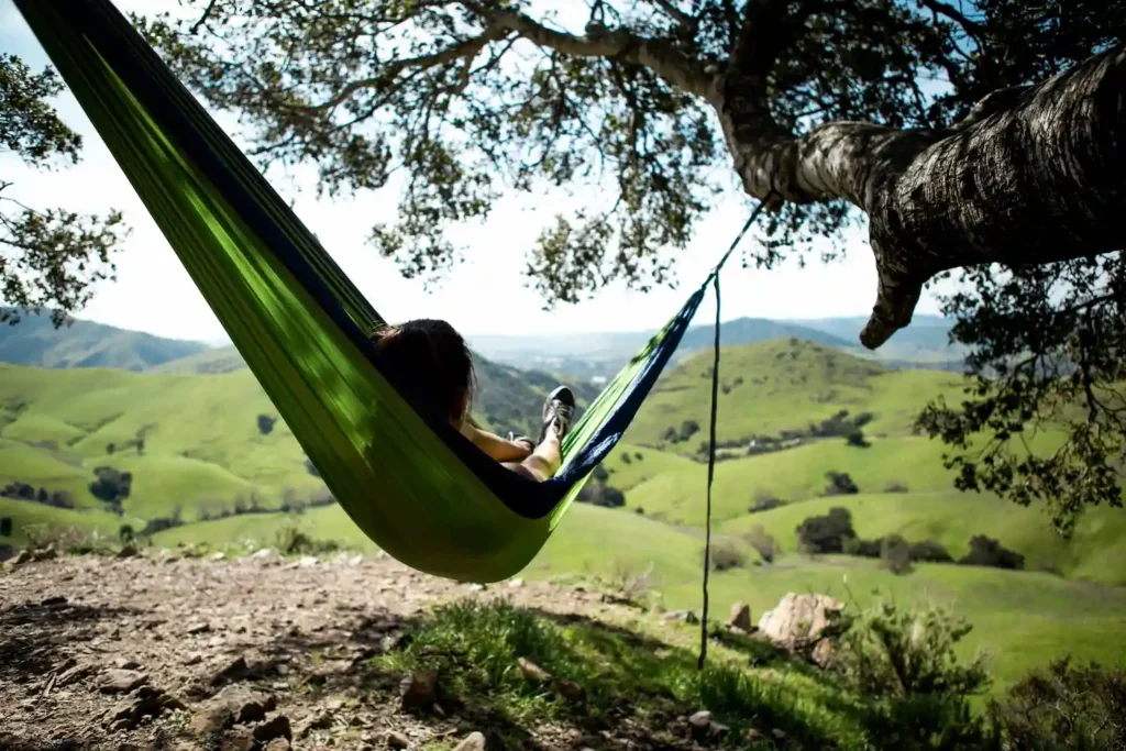 Person in a hammock - disconnect against eco-anxiety